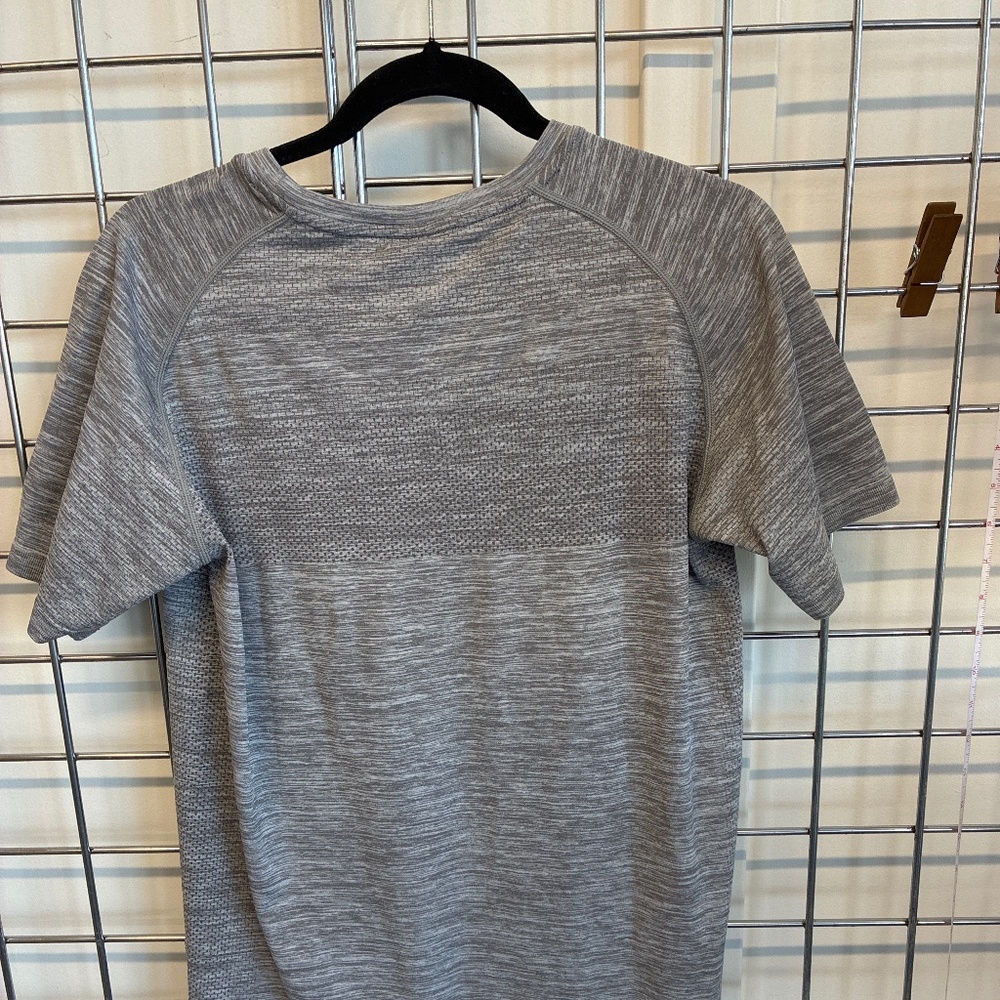 Three Nails active wear shirt.
